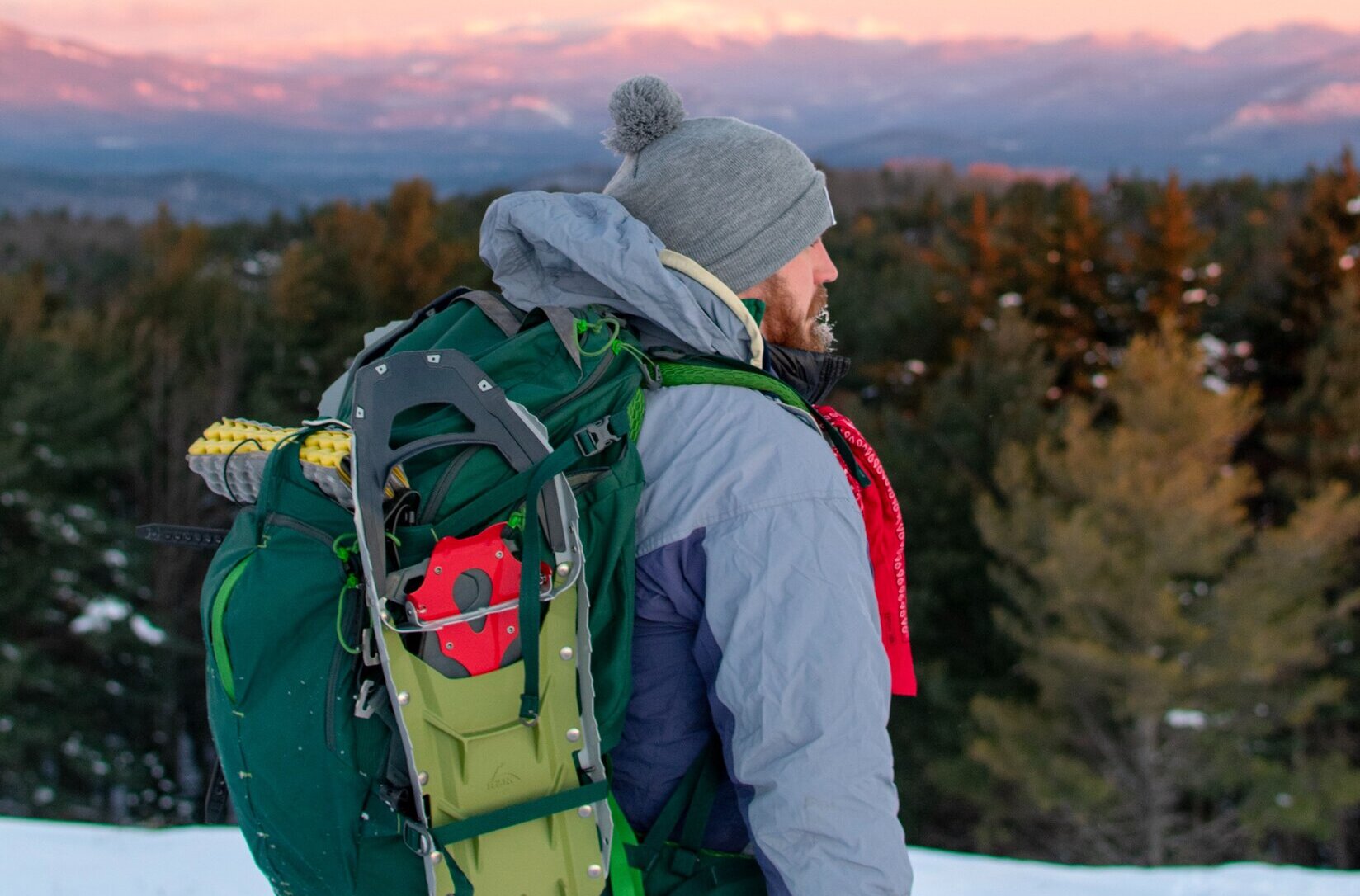 guy looking out over New Hampshire on hike